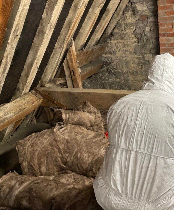 Loft Insulation Being Removed From Loft