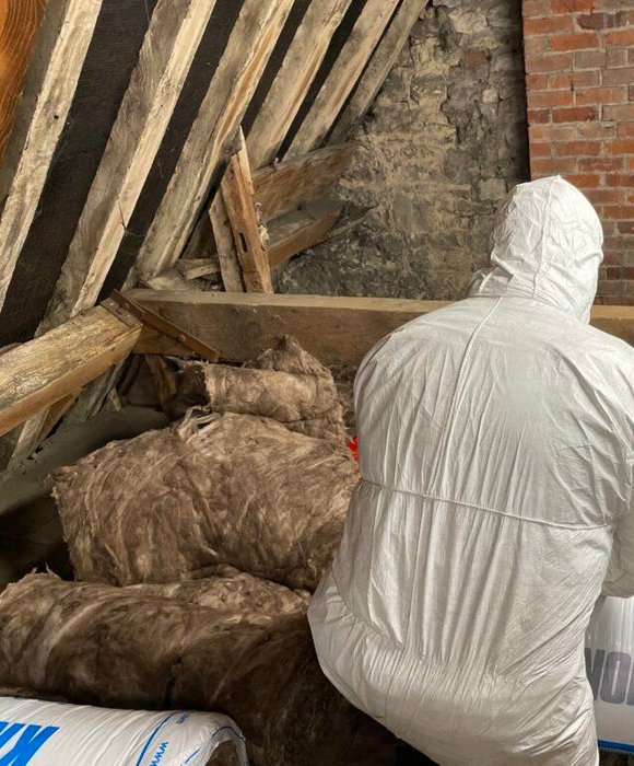 Loft Insulation Being Removed From Loft